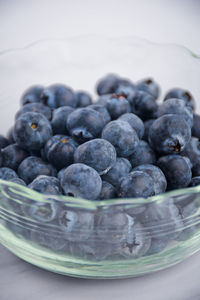 Close-up of blueberries in glass bowl on table
