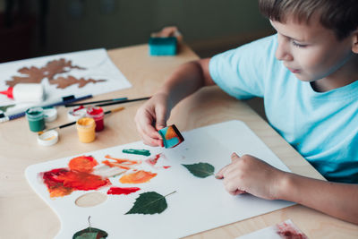 Boy drawing on paper