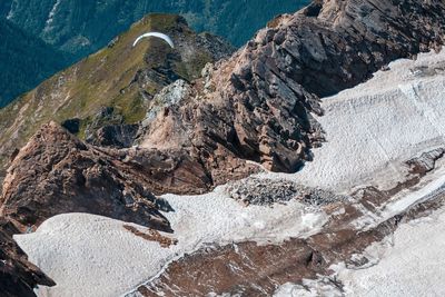 Aerial view of rock on snow covered land