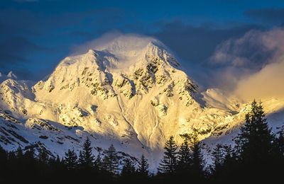 Scenic view of snowcapped mountains against sky during winter