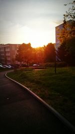 Cars on road at sunset