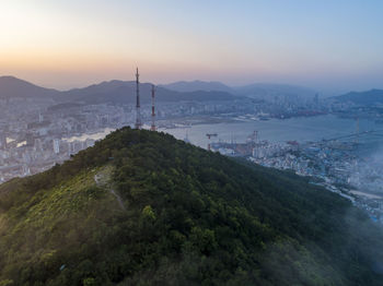 High angle view of bay and buildings against sky