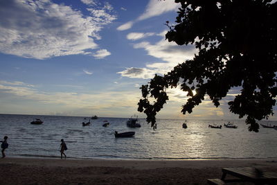 Scenic view of sea against cloudy sky