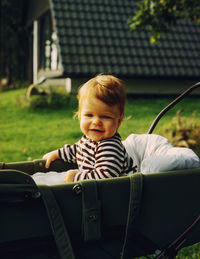 Portrait of cute boy in a stroller