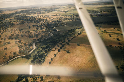 Landscape of field seen through airplane window