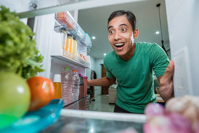 Portrait of smiling man having food