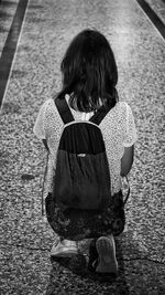 Rear view of girl standing outdoors