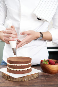 Midsection of woman preparing food