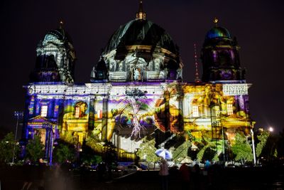 Exterior of berlin cathedral during festival of lights at night
