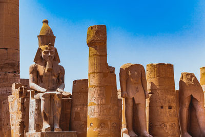 Low angle view of statue against sky