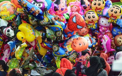 Colorful toys for sale at market stall