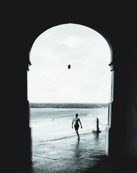 Silhouette of people against clear sky