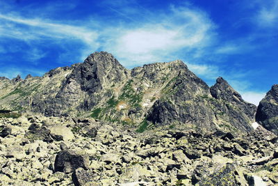 Low angle view of rock formations against sky