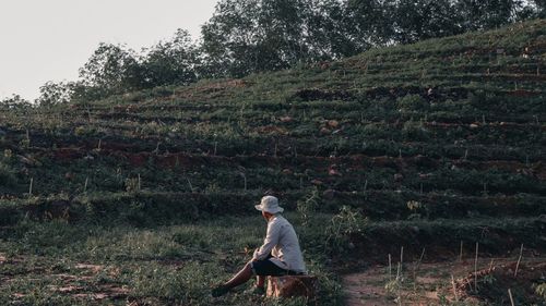 Side view of man standing on field