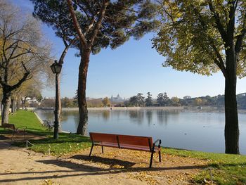 Park bench by lake