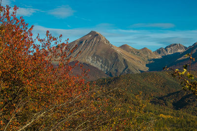 Scenic view of mountains against blue sky in abruzzo near campotosto