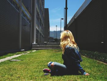 Girl standing on grassy field