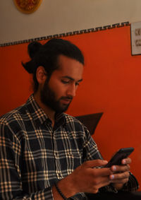 Young man using mobile phone