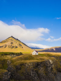 Scenic view of landscape and mountains against sky