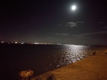 Scenic view of sea against sky at night