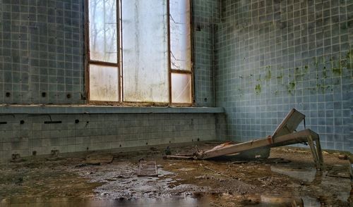 Abandoned building seen through window