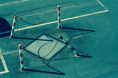 High angle view of barricades around manhole on road