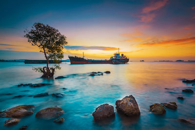 Scenic view of sea against sky during sunset