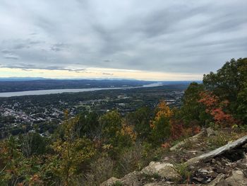 Scenic view of mountains against cloudy sky