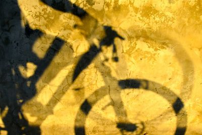 Full frame shot of yellow shadow on wall