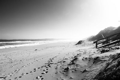 Scenic view of beach against clear sky