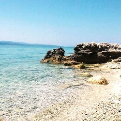 Scenic view of sea against clear blue sky