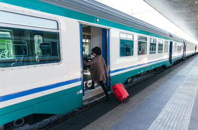 Elegant woman going for business trip on train