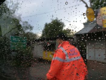 Close-up of wet glass window in rainy season