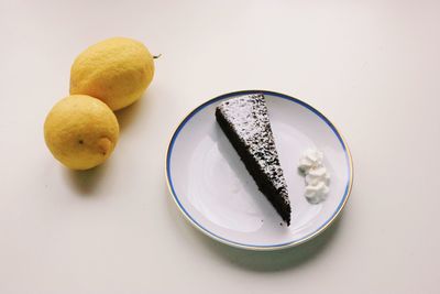 High angle view of fruits in plate on table