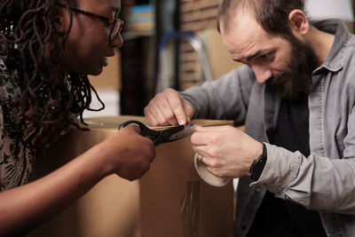 Man and woman packing box