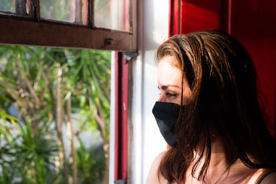 Portrait of young woman looking away