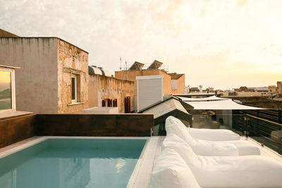 The view on the old buildings on the roof with swimming pool.