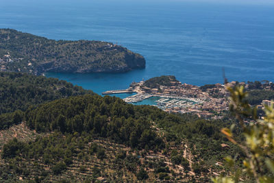 High angle view of sea and trees against sky