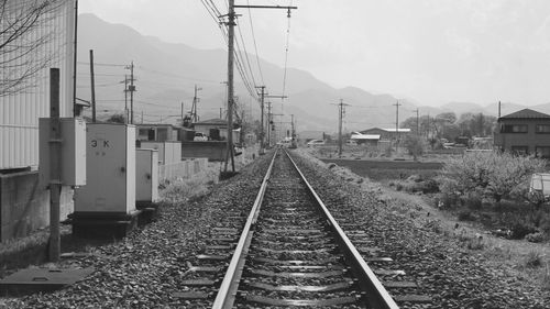 Railroad tracks leading towards mountain