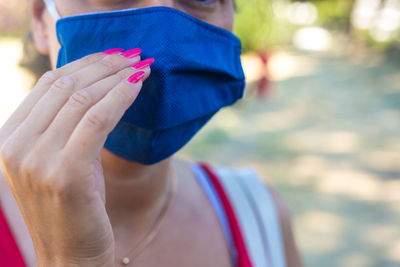 Midsection of woman holding paper currency