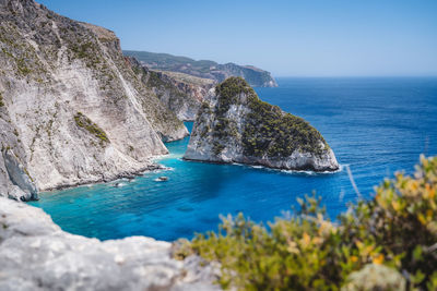 Scenic view of sea against clear blue sky