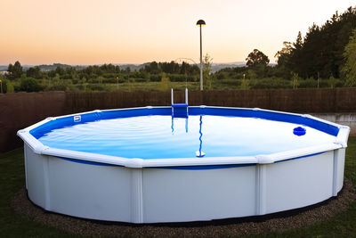 Swimming portable pool in garden at night