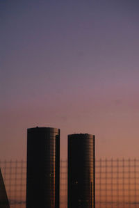 Modern building against sky at dusk