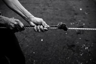 Low angle of man pulling rope