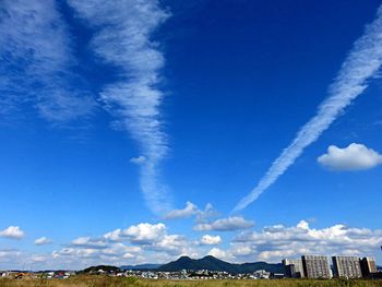 View of landscape against blue sky