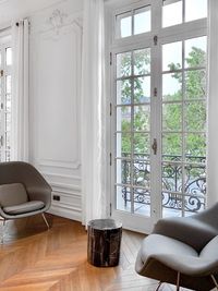 Chairs and table against window at home