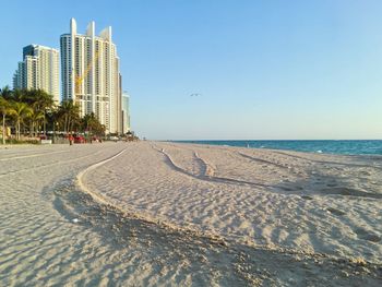 Scenic view of beach against clear sky