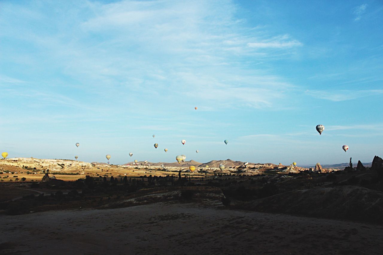 flying, sky, outdoors, hot air balloon, scenics, cloud - sky, transportation, nature, no people, beauty in nature, day, adventure, parachute