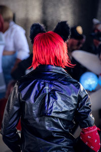 Rear view of woman wearing costume with dyed hair