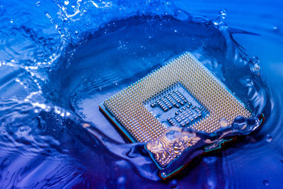 Close-up of laptop on swimming pool